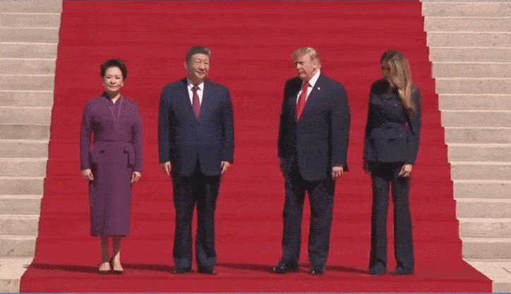 Trump and China's President Xi Walking up a red carpeted staircase hand in hand
